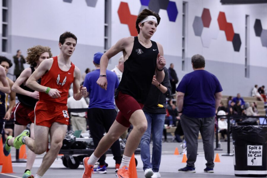 Junior Carter Webb races to the finish during the mile.