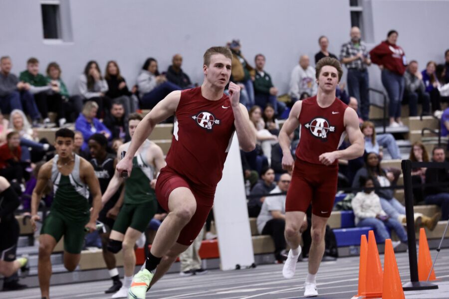 Joey Neuman and Payton Holmes running in the 4x400 heat.