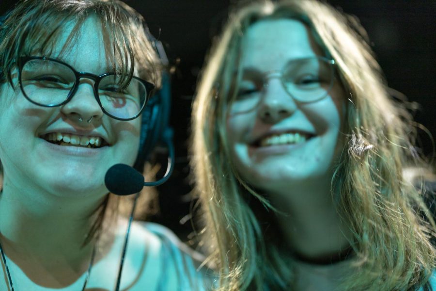 Pictured is Annabelle Gussarson (left) and Emma Hanhus (right), working backstage for the Descendants musical.