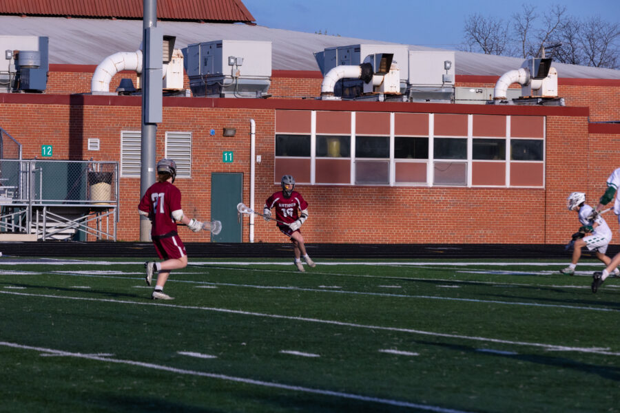 Mid-fielder Charlie Hulting carrying the ball against Grayslake Central.