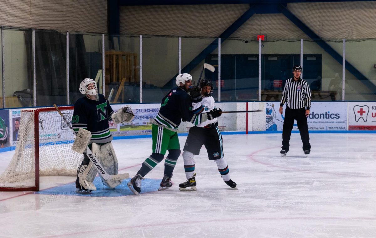 The Lakers during their home opener against New Trier High School.