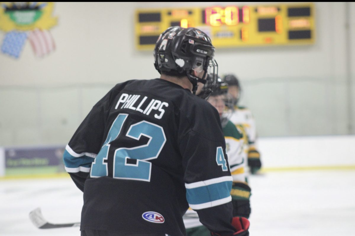 Zion-Benton senior forward Sebastian Phillips on the ice.