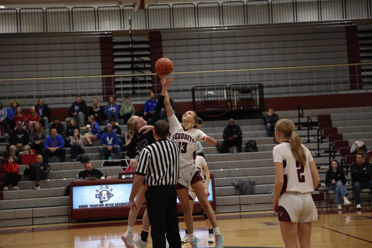 Sophomore Heidi Rathmann winning the jump ball.