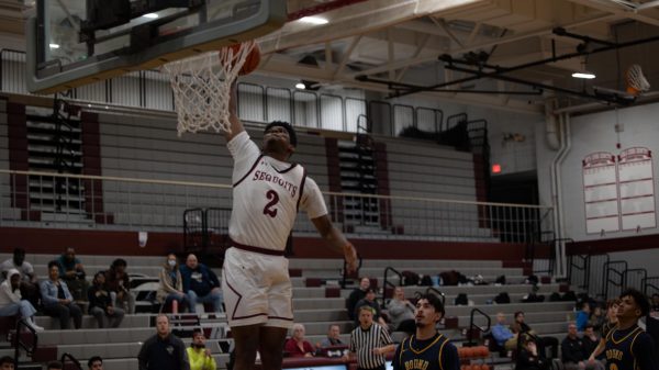 Junior Marshall Gehrke dunking on the Round Lake Panthers.