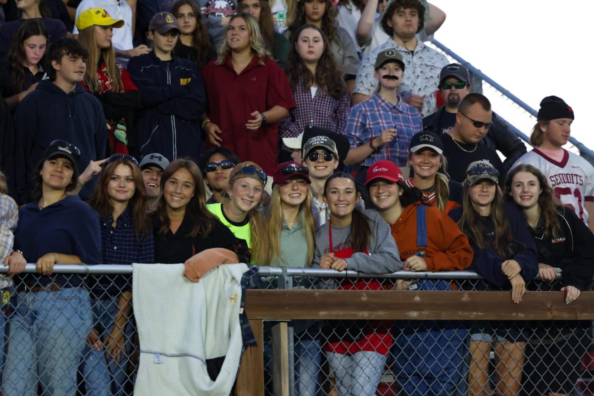 Cardinal+Crazies+cheering+on+the+football+team.