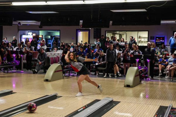 Senior Savanna Lehman bowls the ball