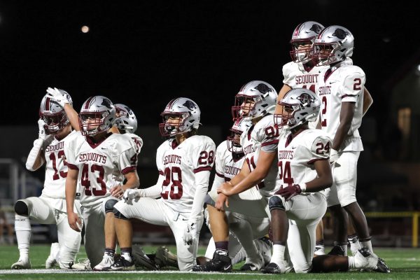Varsity defense huddle during timeout.